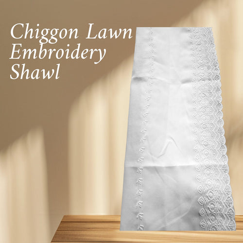 White embroidery shawl on a wooden surface with a beige background